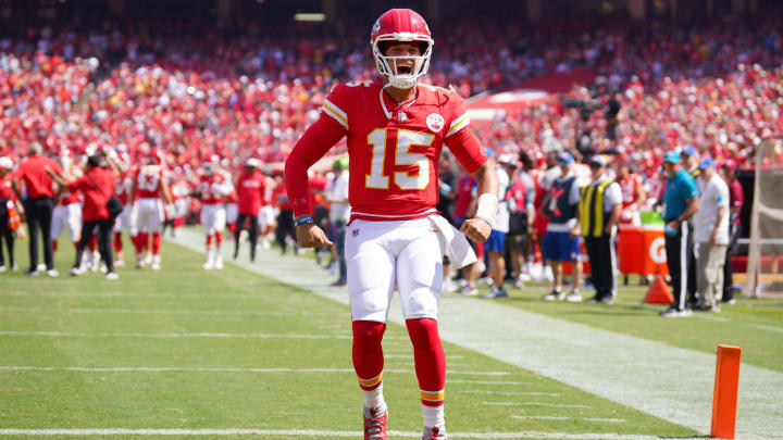 Aug 17, 2024; Kansas City, Missouri, USA; Kansas City Chiefs quarterback Patrick Mahomes (15) celebrates toward fans against the Detroit Lions prior to a game at GEHA Field at Arrowhead Stadium. Mandatory Credit: Denny Medley-USA TODAY Sports