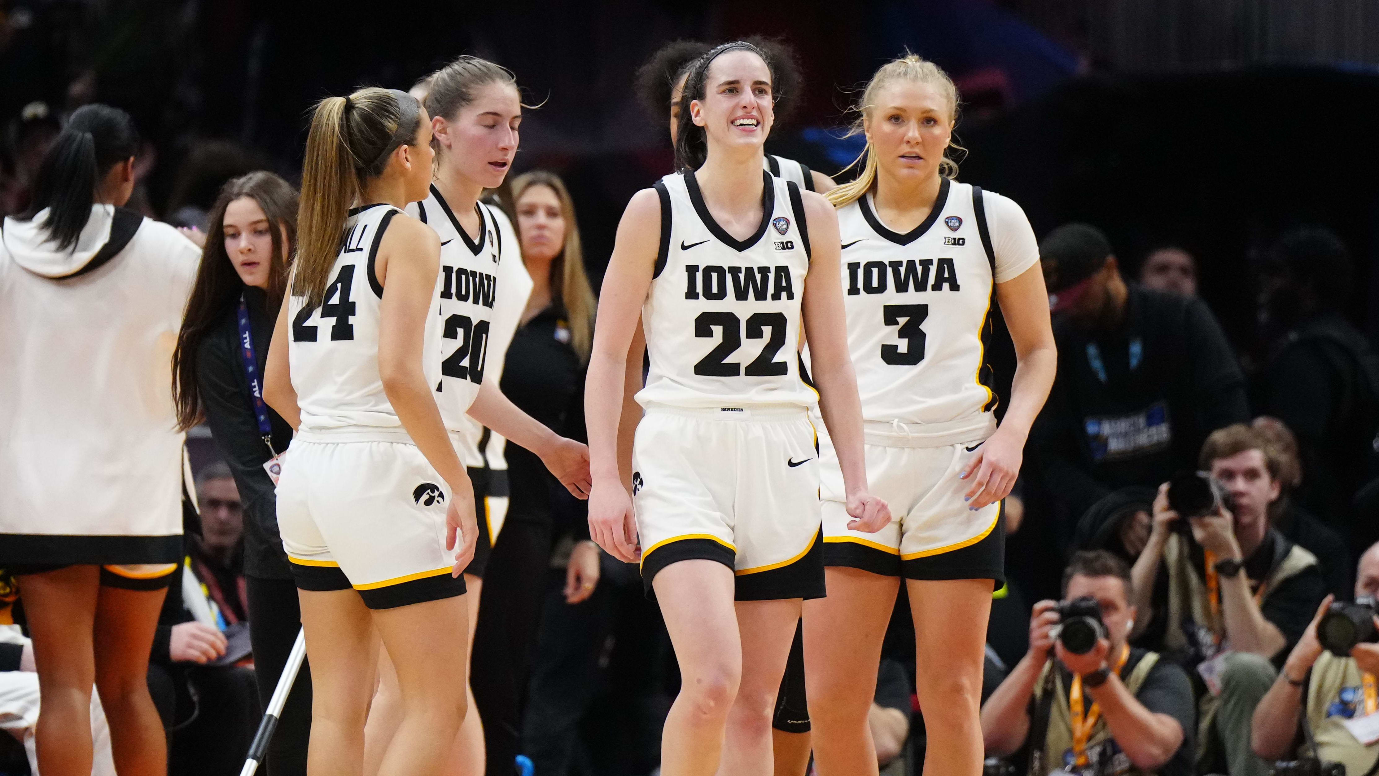 Iowa Hawkeyes guard Caitlin Clark (22) reacts after a three pointer.