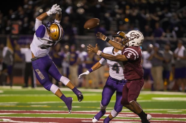 Calallen Wildcats battle the San Benito Greyhounds during their high school football season opener at Wildcat Stadium.