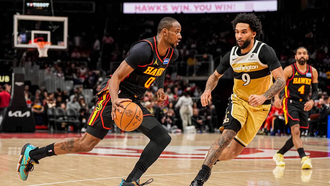 Feb 24, 2026; Atlanta, Georgia, USA; Atlanta Hawks forward Jonathan Kuminga (0) dribbles past Washington Wizards forward Justin Champagnie (9) during the second half at State Farm Arena. Mandatory Credit: Dale Zanine-Imagn Images Feb 24, 2026; Atlanta, Georgia, USA; Atlanta Hawks forward Jonathan Kuminga (0) dribbles past Washington Wizards forward Justin Champagnie (9) during the second half at State Farm Arena. Mandatory Credit: Dale Zanine-Imagn Images