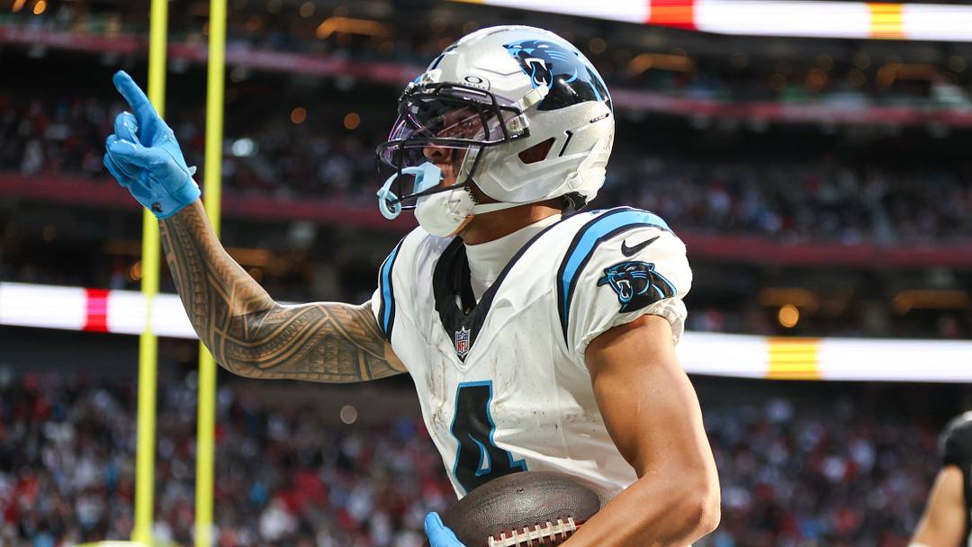 Carolina Panthers wide receiver Tetairoa McMillan (4) celebrates a touchdown in the fourth quarter against the Atlanta Falcons at Mercedes-Benz Stadium. 
