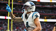 Nov 16, 2025; Atlanta, Georgia, USA; Carolina Panthers wide receiver Tetairoa McMillan (4) celebrates a touchdown in the fourth quarter against the Atlanta Falcons at Mercedes-Benz Stadium. Mandatory Credit: Brett Davis-Imagn Images