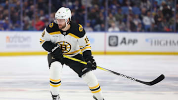 Apr 6, 2025; Buffalo, New York, USA;  Boston Bruins center Pavel Zacha (18) looks for the puck during the first period against the Buffalo Sabres at KeyBank Center. Mandatory Credit: Timothy T. Ludwig-Imagn Images
