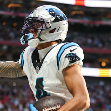Nov 16, 2025; Atlanta, Georgia, USA; Carolina Panthers wide receiver Tetairoa McMillan (4) celebrates a touchdown in the fourth quarter against the Atlanta Falcons at Mercedes-Benz Stadium. Mandatory Credit: Brett Davis-Imagn Images