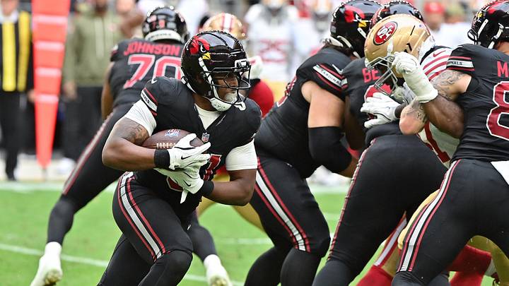 Nov 16, 2025; Glendale, Arizona, USA; Arizona Cardinals running back Emari Demercado (31) runs the ball in the first half against the San Francisco 49ers at State Farm Stadium. Mandatory Credit: Matt Kartozian-Imagn Images