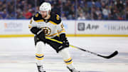 Apr 6, 2025; Buffalo, New York, USA;  Boston Bruins center Pavel Zacha (18) looks for the puck during the first period against the Buffalo Sabres at KeyBank Center. Mandatory Credit: Timothy T. Ludwig-Imagn Images
