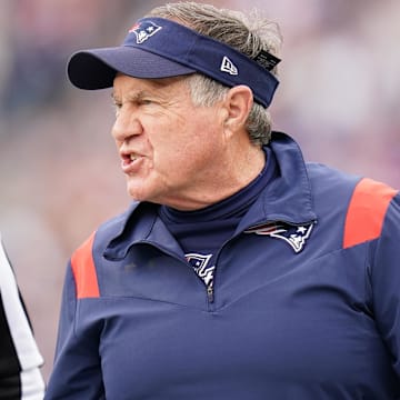 Jan 1, 2023; Foxborough, Massachusetts, USA; New England Patriots head coach Bill Belichick watches from the sideline as they take on the Miami Dolphins at Gillette Stadium.