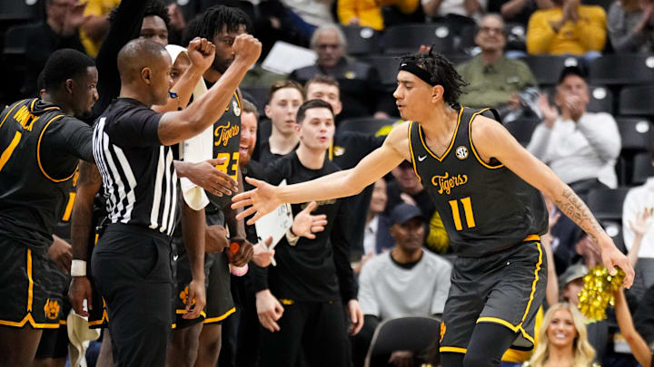 Dec 14, 2024; Columbia, Missouri, USA; Missouri Tigers guard Trent Pierce (11) celebrates with team mates after scoring against the LIU Sharks during the second half at Mizzou Arena. Mandatory Credit: Denny Medley-Imagn Images