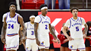 Feb 15, 2025; Salt Lake City, Utah, USA; Kansas Jayhawks forward KJ Adams (24), guard AJ Storr (2), guard Zeke Mayo (5), and guard Dajuan Harris Jr. (3) on the court against the Utah Utes during the first half at the Jon M. Huntsman Center. Mandatory Credit: Christopher Creveling-Imagn Images