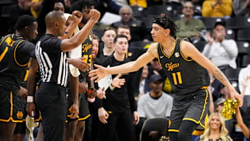 Dec 14, 2024; Columbia, Missouri, USA; Missouri Tigers guard Trent Pierce (11) celebrates with team mates after scoring against the LIU Sharks during the second half at Mizzou Arena. Mandatory Credit: Denny Medley-Imagn Images