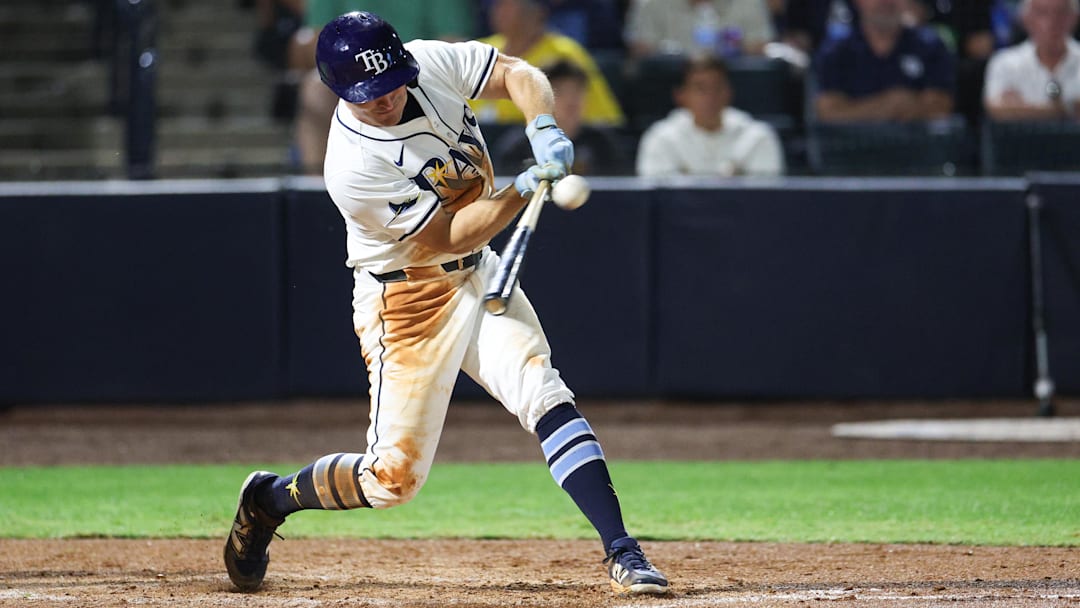 Mar 31, 2025; St. Petersburg, Florida, USA; Tampa Bay Rays right fielder Jake Mangum (28) doubles against the Pittsburgh Pirates in the sixth inning at George M. Steinbrenner Field. Mar 31, 2025; St. Petersburg, Florida, USA; Tampa Bay Rays right fielder Jake Mangum (28) doubles against the Pittsburgh Pirates in the sixth inning at George M. Steinbrenner Field.
