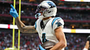 Nov 16, 2025; Atlanta, Georgia, USA; Carolina Panthers wide receiver Tetairoa McMillan (4) celebrates a touchdown in the fourth quarter against the Atlanta Falcons at Mercedes-Benz Stadium. Mandatory Credit: Brett Davis-Imagn Images