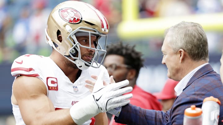 San Francisco 49ers defensive end Nick Bosa (97) reacts with general manager John Lynch