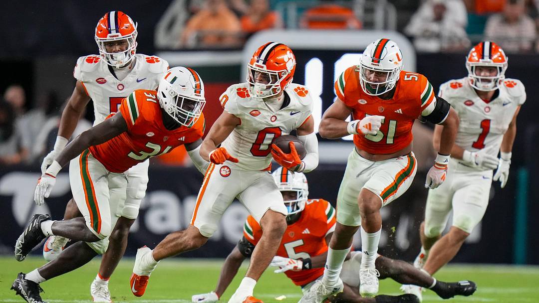 Oct 21, 2023; Miami Gardens, Florida, USA; Clemson Tigers wide receiver Antonio Williams (0)  runs the ball against the Miami Hurricanes during the second quarter at Hard Rock Stadium. Mandatory Credit: Rich Storry-Imagn Images