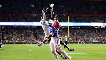 Oct 5, 2024; Gainesville, Florida, USA; Florida Gators defensive back Bryce Thornton (18) breaks up a pass to UCF Knights tight end Randy Pittman Jr. (5) during the first half at Ben Hill Griffin Stadium. Mandatory Credit: Matt Pendleton-Imagn Images
