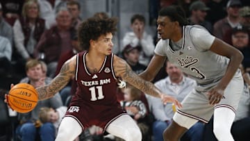 Feb 18, 2025; Starkville, Mississippi, USA; Texas A&M Aggies forward Andersson Garcia (11) dribbles against Mississippi State Bulldogs forward KeShawn Murphy (3) during the second half at Humphrey Coliseum. Mandatory Credit: Petre Thomas-Imagn Images
