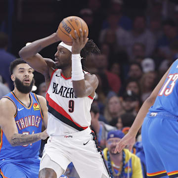 Mar 7, 2025; Oklahoma City, Oklahoma, USA; Portland Trail Blazers forward Jerami Grant (9) drives to the basket around Oklahoma City Thunder forward Kenrich Williams (34) during the first quarter at Paycom Center. Mandatory Credit: Alonzo Adams-Imagn Images