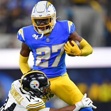 Nov 9, 2025; Inglewood, California, USA; Pittsburgh Steelers running back Kenneth Gainwell (14) tackles Los Angeles Chargers safety RJ Mickens (27) after an interception during the second quarter of the game at SoFi Stadium. Mandatory Credit: Gary A. Vasquez-Imagn Images