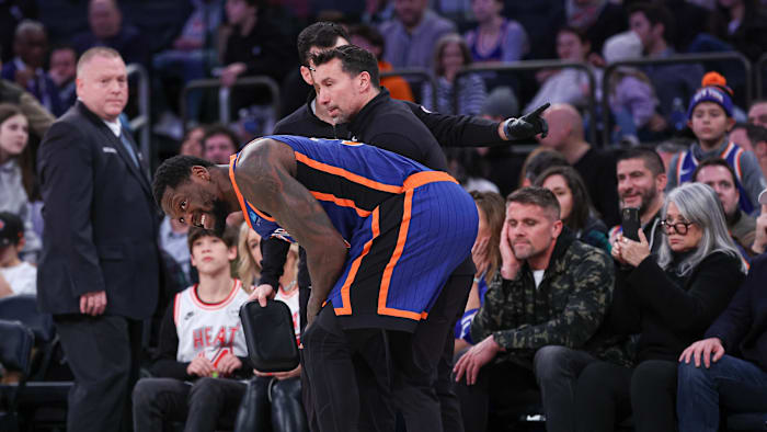 Jan 27, 2024; New York, New York, USA; New York Knicks forward Julius Randle (30) is helped by