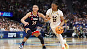 Apr 6, 2025; Tampa, FL, USA; Connecticut Huskies guard Azzi Fudd (35) defends against South Carolina Gamecocks guard MiLaysia Fulwiley (12) during the second half of the national championship of the women's 2025 NCAA tournament at Amalie Arena. Mandatory Credit: Nathan Ray Seebeck-Imagn Images