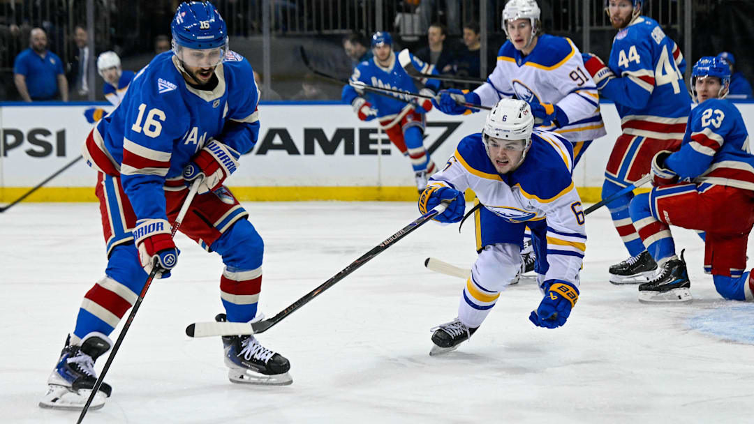 Apr 8, 2026; New York, New York, USA; Buffalo Sabres left wing Zach Benson (6) and New York Rangers center Vincent Trocheck (16) battle for a loose puck during the first period at Madison Square Garden. Mandatory Credit: Dennis Schneidler-Imagn Images