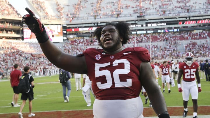 Sep 23, 2023; Tuscaloosa, Alabama, USA;  Alabama Crimson Tide offensive lineman Tyler Booker (52) celebrates as he leaves the field at Bryant-Denny Stadium. Alabama defeated Mississippi 24-10. Mandatory Credit: Gary Cosby Jr.-USA TODAY Sports