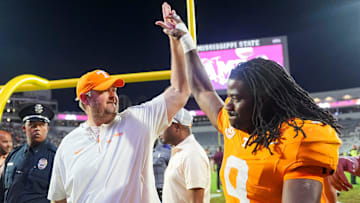 Tennessee coach Josh Heupel high fives Tennessee running back Star Thomas (9) after the Vols defeated Mississippi State in overtime at Davis Wade Stadium in Starkville, Miss., on Sept. 27, 2025.