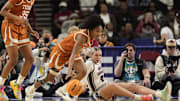Texas Longhorns guard Rori Harmon (3) grabs a loose ball as South Carolina Gamecocks forward Chloe Kitts (21) watches during the first half at Bon Secours Wellness Arena. Mandatory Credit: Jim Dedmon-Imagn Images