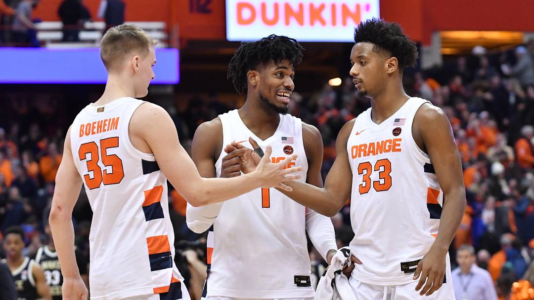 Feb 8, 2020; Syracuse, New York, USA; Syracuse Orange guard Buddy Boeheim (35) and forward Quincy Guerrier (1) and forward Elijah Hughes (33) celebrate after defeating the Wake Forest Demon Deacons by a score of 75-73 at the Carrier Dome. Mandatory Credit: Mark Konezny-Imagn Images Feb 8, 2020; Syracuse, New York, USA; Syracuse Orange guard Buddy Boeheim (35) and forward Quincy Guerrier (1) and forward Elijah Hughes (33) celebrate after defeating the Wake Forest Demon Deacons by a score of 75-73 at the Carrier Dome. Mandatory Credit: Mark Konezny-Imagn Images