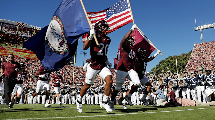 Sep 7, 2024; Blacksburg, Virginia, USA; The Virginia Tech Hokies runs onto the field before the game against the Marshall Thundering Herd at Lane Stadium.