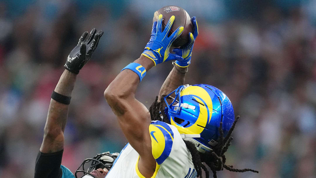 Oct 19, 2025; London, United Kingdom; Los Angeles Rams wide receiver Davante Adams (17) makes a catch against Jacksonville Jaguars wide receiver Travis Hunter (12) during the second half of an NFL International Series game at Wembley Stadium. Mandatory Credit: Kirby Lee-Imagn Images