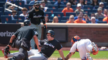 Aug 18, 2024; New York City, New York, USA; Miami Marlins first baseman Jonah Bride (41) scores a run as New York Mets catcher Francisco Alvarez (4) attempts a tag during the eighth inning at Citi Field. Mandatory Credit: Vincent Carchietta-USA TODAY Sports