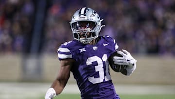 Nov 23, 2024; Manhattan, Kansas, USA; Kansas State Wildcats running back DJ Giddens (31) carries the ball during the fourth quarter against the Cincinnati Bearcats at Bill Snyder Family Football Stadium. Mandatory Credit: Scott Sewell-Imagn Images