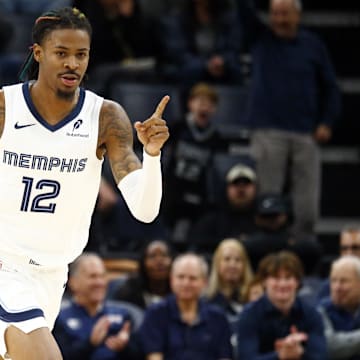 Nov 25, 2024; Memphis, Tennessee, USA; Memphis Grizzlies guard Ja Morant (12) reacts during the first half against the Portland Trail Blazers at FedExForum. Mandatory Credit: Petre Thomas-Imagn Images