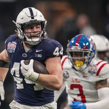 Penn State Nittany Lions tight end Tyler Warren runs for a long gain after a catch against the Mississippi Rebels in the 2023 Peach Bowl at Mercedes-Benz Stadium in Atlanta. 
