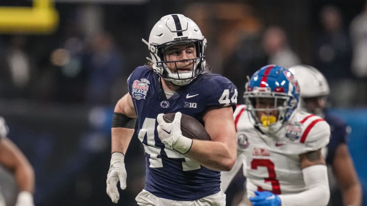 Penn State Nittany Lions tight end Tyler Warren runs for a long gain after a catch against Ole Mis in the Peach Bowl. 