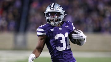 Nov 23, 2024; Manhattan, Kansas, USA; Kansas State Wildcats running back DJ Giddens (31) carries the ball during the fourth quarter against the Cincinnati Bearcats at Bill Snyder Family Football Stadium. 