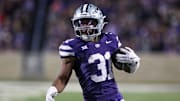 Nov 23, 2024; Manhattan, Kansas, USA; Kansas State Wildcats running back DJ Giddens (31) carries the ball during the fourth quarter against the Cincinnati Bearcats at Bill Snyder Family Football Stadium. Mandatory Credit: Scott Sewell-Imagn Images