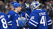 Apr 12, 2025; Toronto, Ontario, CAN;  Toronto Maple Leafs goalie Anthony Stolarz (41) is greeted by forward Auston Matthews (34) as they celebrate an overtime win over the Montreal Canadiens at Scotiabank Arena. Mandatory Credit: Dan Hamilton-Imagn Images