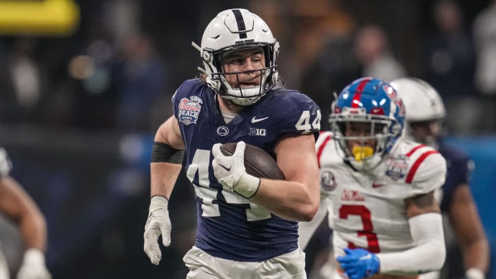 Penn State Nittany Lions tight end Tyler Warren runs for a long gain after a catch against Ole Miss in the 2023 Peach Bowl.