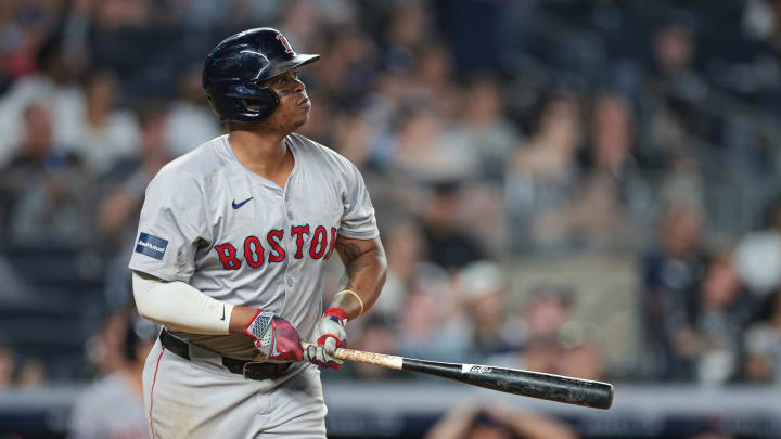 Boston Red Sox third baseman Rafael Devers (11) looks up at his solo home run during the ninth inning against the New York Yankees at Yankee Stadium on July 8.