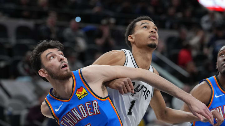 Feb 29, 2024; San Antonio, Texas, USA;  Oklahoma City Thunder forward Chet Holmgren (7) and San Antonio Spurs center Victor Wembanyama (1) battle for position in the first half at Frost Bank Center. Mandatory Credit: Daniel Dunn-USA TODAY Sports