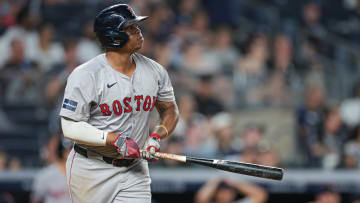 Boston Red Sox third baseman Rafael Devers (11) looks up at his solo home run.