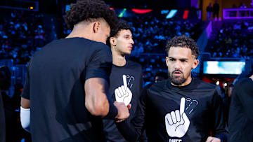 Jalen Johnson #1, Zaccharie Risacher #10, and Trae Young #1 of the Atlanta Hawks are introduced before facing the Dallas Mavericks.