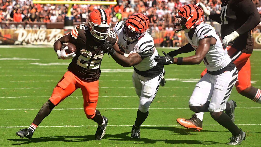 Sep 7, 2025; Cleveland, Ohio, USA; Cleveland Browns running back Dylan Sampson (22) is chased by Cincinnati Bengals linebacker Barrett Carter (49) and safety Jordan Battle (27) during the second half at Huntington Bank Field. Mandatory Credit: Ken Blaze-Imagn Images