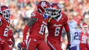 Houston Cougars defensive back Will James (15) celebrates with defensive back Kentrell Webb (8) after an interception during the second quarter against the TCU Horned Frogs at TDECU Stadium. 
