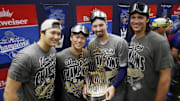 Oct 31, 2025; Toronto, Ontario, CAN; Los Angeles Dodgers two-way player Shohei Ohtani (17) and pitcher Yoshinobu Yamamoto (18) and pitcher Blake Snell (7) and pitcher Tyler Glasnow (31) celebrate with the Commissioner's Trophy in the clubhouse after defeating the Toronto Blue Jays in the 2025 MLB World Series at Rogers Centre. Mandatory Credit: John E. Sokolowski-Imagn Images