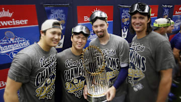 Oct 31, 2025; Toronto, Ontario, CAN; Los Angeles Dodgers two-way player Shohei Ohtani (17) and pitcher Yoshinobu Yamamoto (18) and pitcher Blake Snell (7) and pitcher Tyler Glasnow (31) celebrate with the Commissioner's Trophy in the clubhouse after defeating the Toronto Blue Jays in the 2025 MLB World Series at Rogers Centre. Mandatory Credit: John E. Sokolowski-Imagn Images