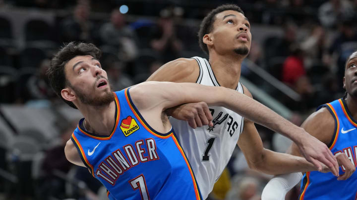 Feb 29, 2024; San Antonio, Texas, USA;  Oklahoma City Thunder forward Chet Holmgren (7) and San Antonio Spurs center Victor Wembanyama (1) battle for position in the first half at Frost Bank Center. Mandatory Credit: Daniel Dunn-USA TODAY Sports