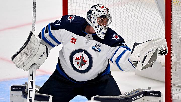 Apr 2, 2026; Dallas, Texas, USA; Winnipeg Jets goaltender Connor Hellebuyck (37) makes a glove save on a Dallas Stars shot during the second period at the American Airlines Center. Mandatory Credit: Jerome Miron-Imagn Images